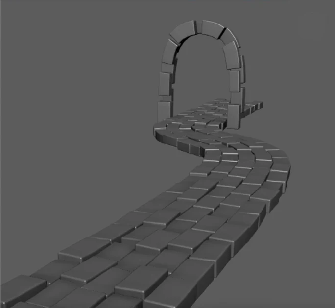 A cobbled path in Maya winding along a curve up to a stone arch